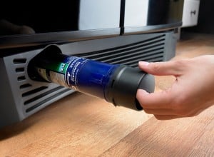 changing a refrigerator water filter at the bottom of the fridge grill