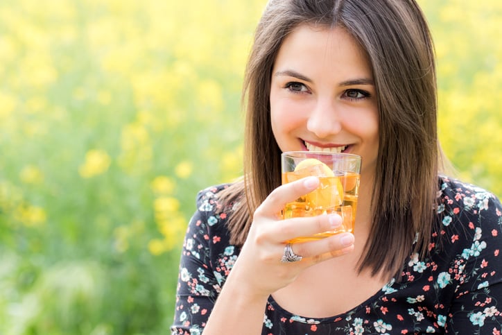 Young lady drinking the perfect glass of iced tea