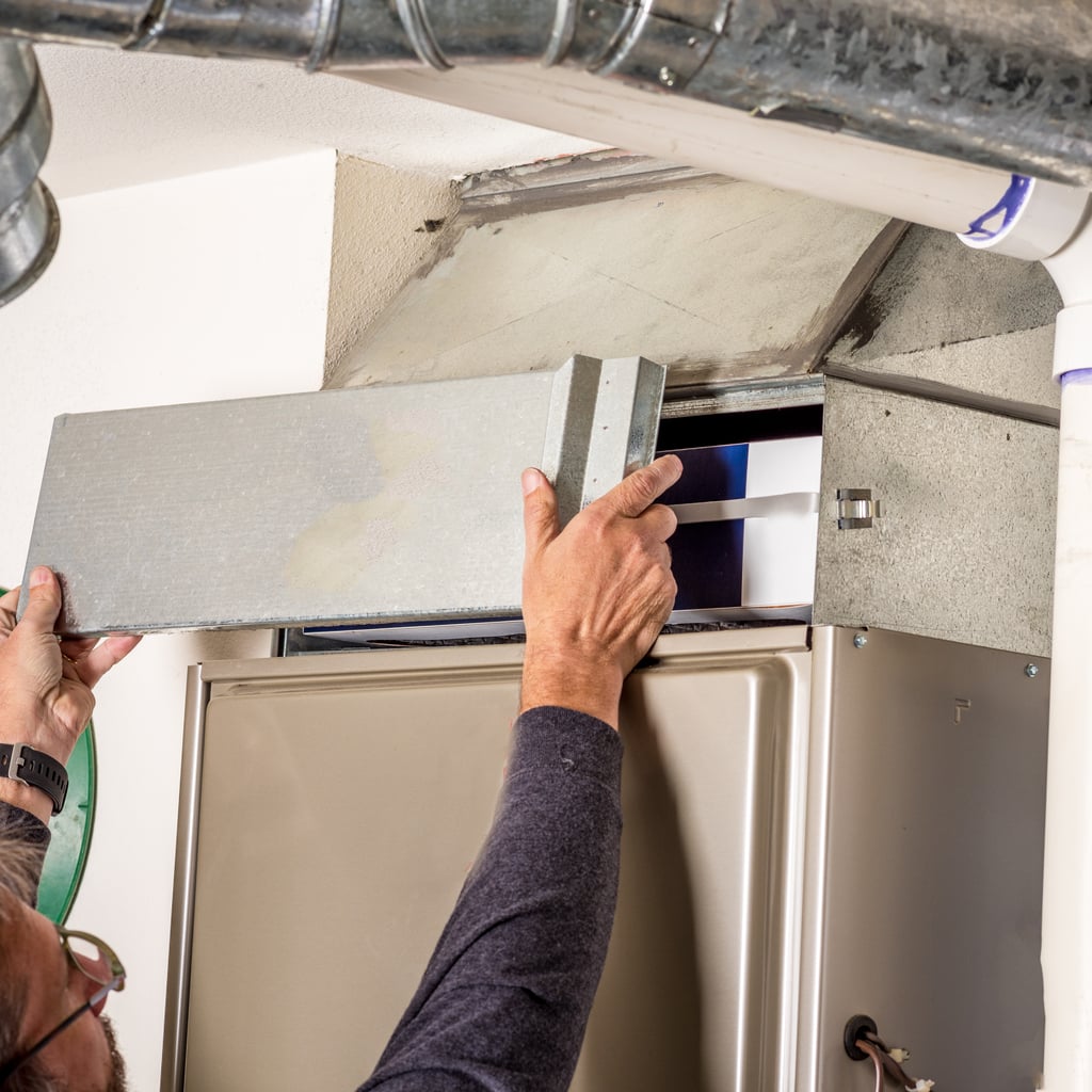 fall home repairs changing furnace filter