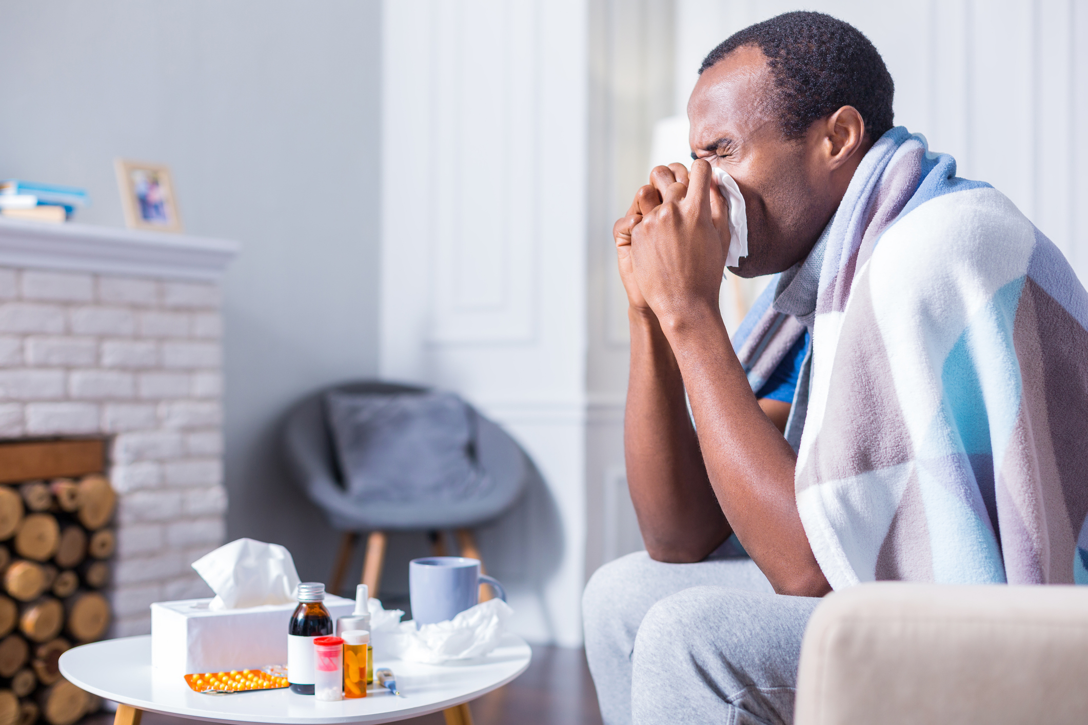 man sneezing from bad spring allergies