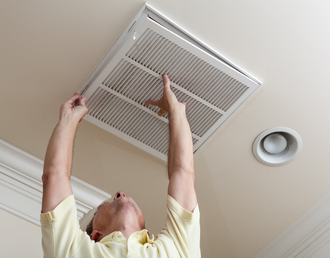man changing air filter