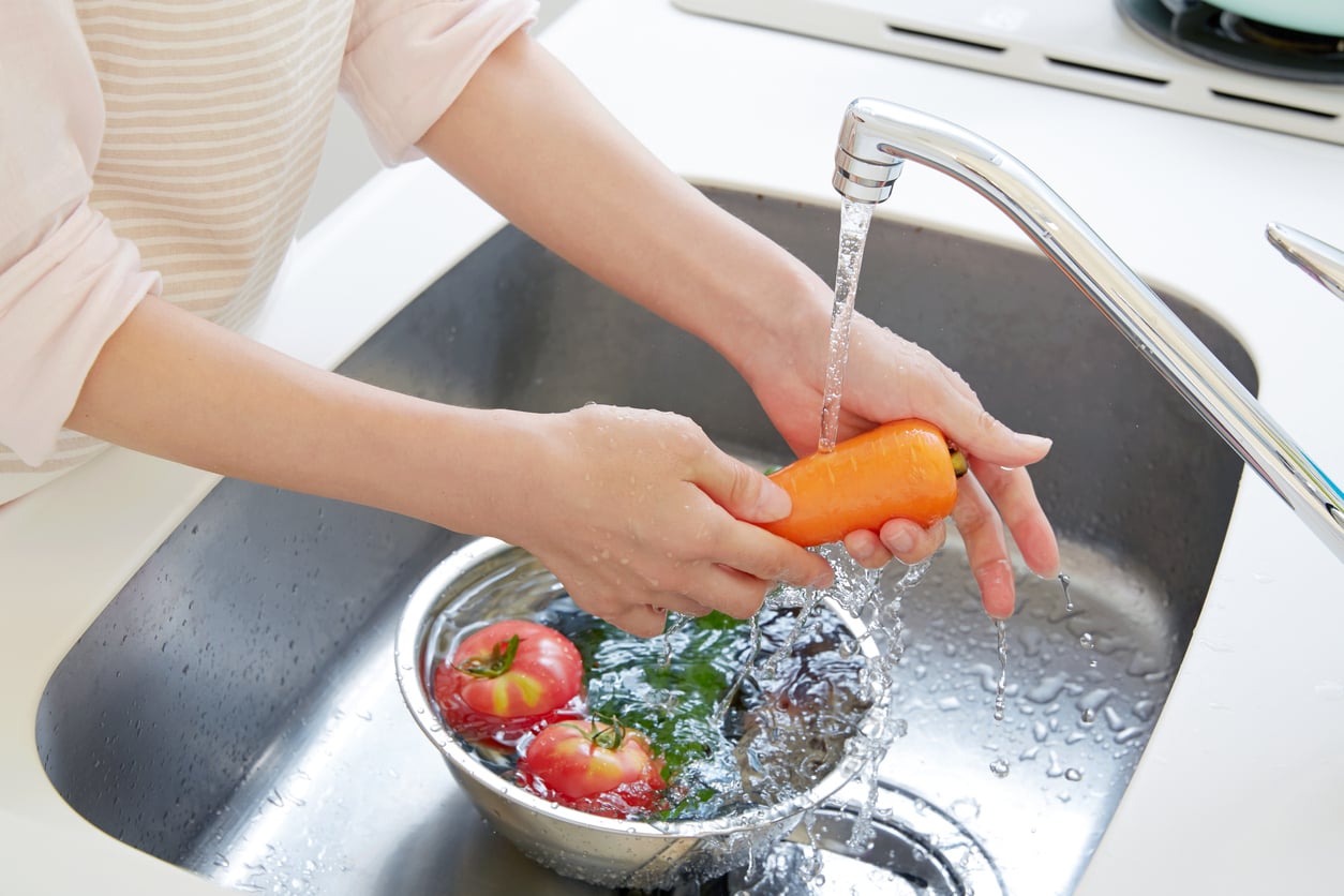 washing vegetables with water filtered by a whole house filter system