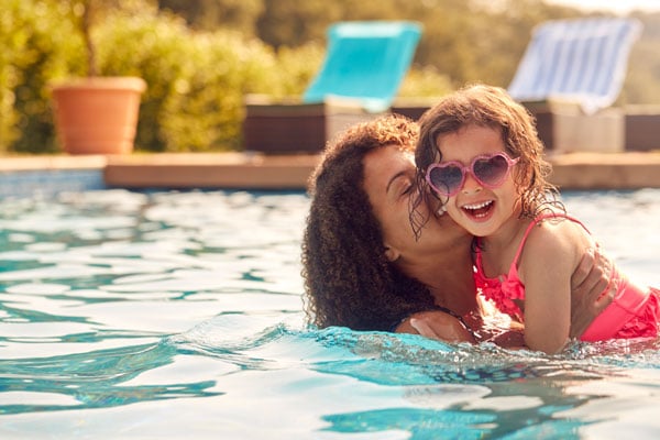 mother and daughter in swimming pool