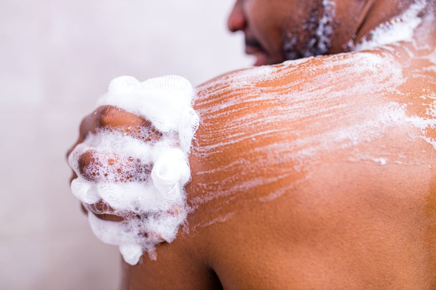 Man with sensitive skin taking shower