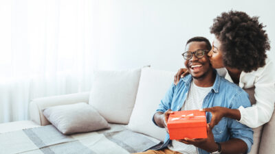 happy couple exchanging gifts
