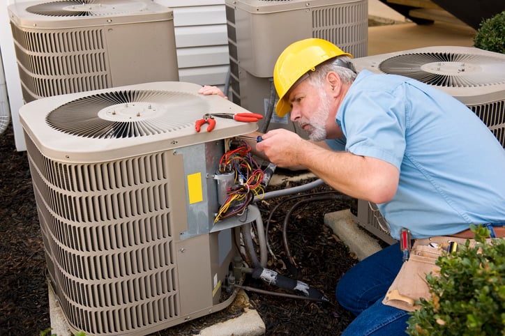 hvac repair service being performed by hvac technician