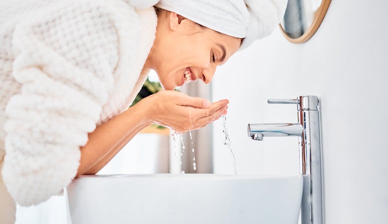 woman performing good hygiene thanks to clean water