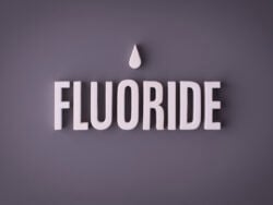 Fluoride lettering sign made with colorful background and white ceramic letters.