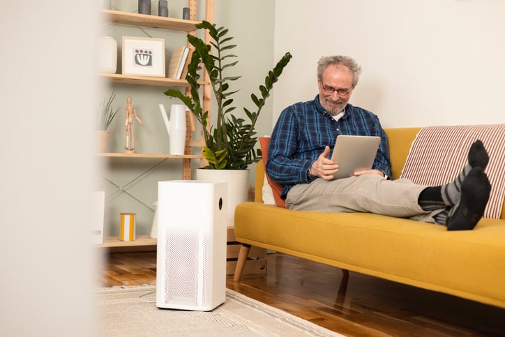 older gentleman enjoying great air from his air purifier