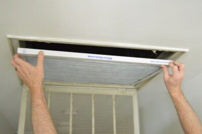 Photo demonstrating how to position an air filter when installing it in the ceiling