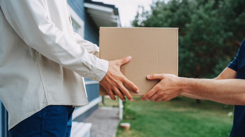 person receiving item from filter subscription service